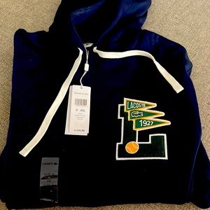 Lacoste 1927 Logo hooded sweatshirt with front pouch pocket.